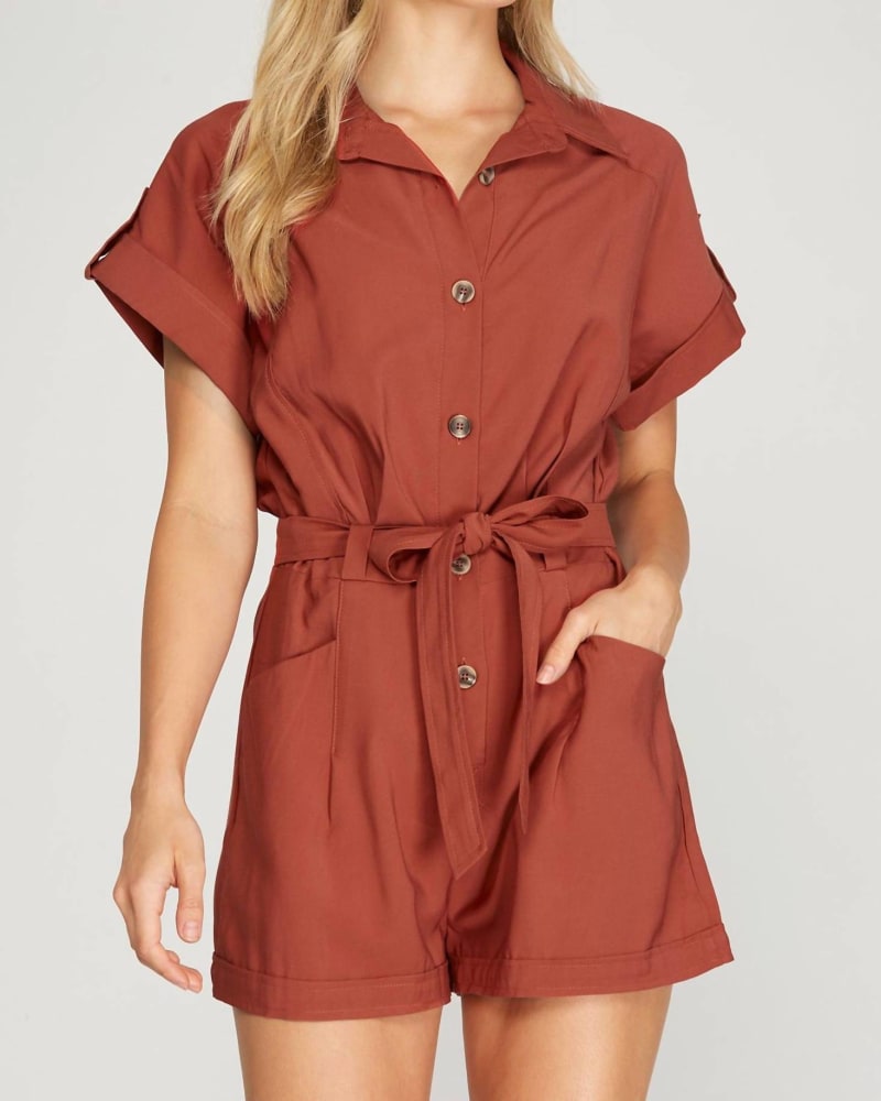 Front of a model wearing a size Large Drop Shoulder Woven Twill Romper With Pockets In Rust in Rust by SHE + SKY. | dia_product_style_image_id:350783